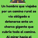 Un hombre viajando por un camino rural
